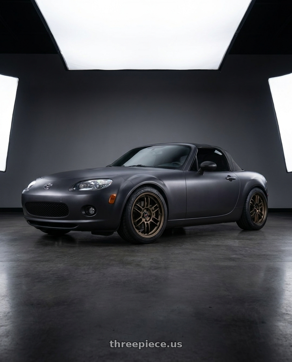 2007 Mazda Miata MX-5 with Volk Racing RAYS F6 BOOST 5x114.3 17x7+40 Dark Bronze wheels