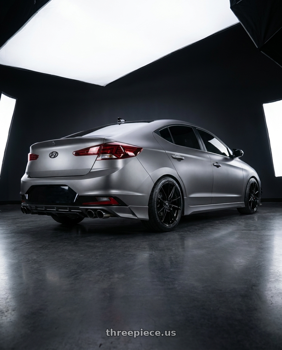 2020 Hyundai Elantra Sport MK6.5 with MST Wheels DELTA 5X108 18x8.5 +35 Glossy Black wheels rear three quarter view square tires