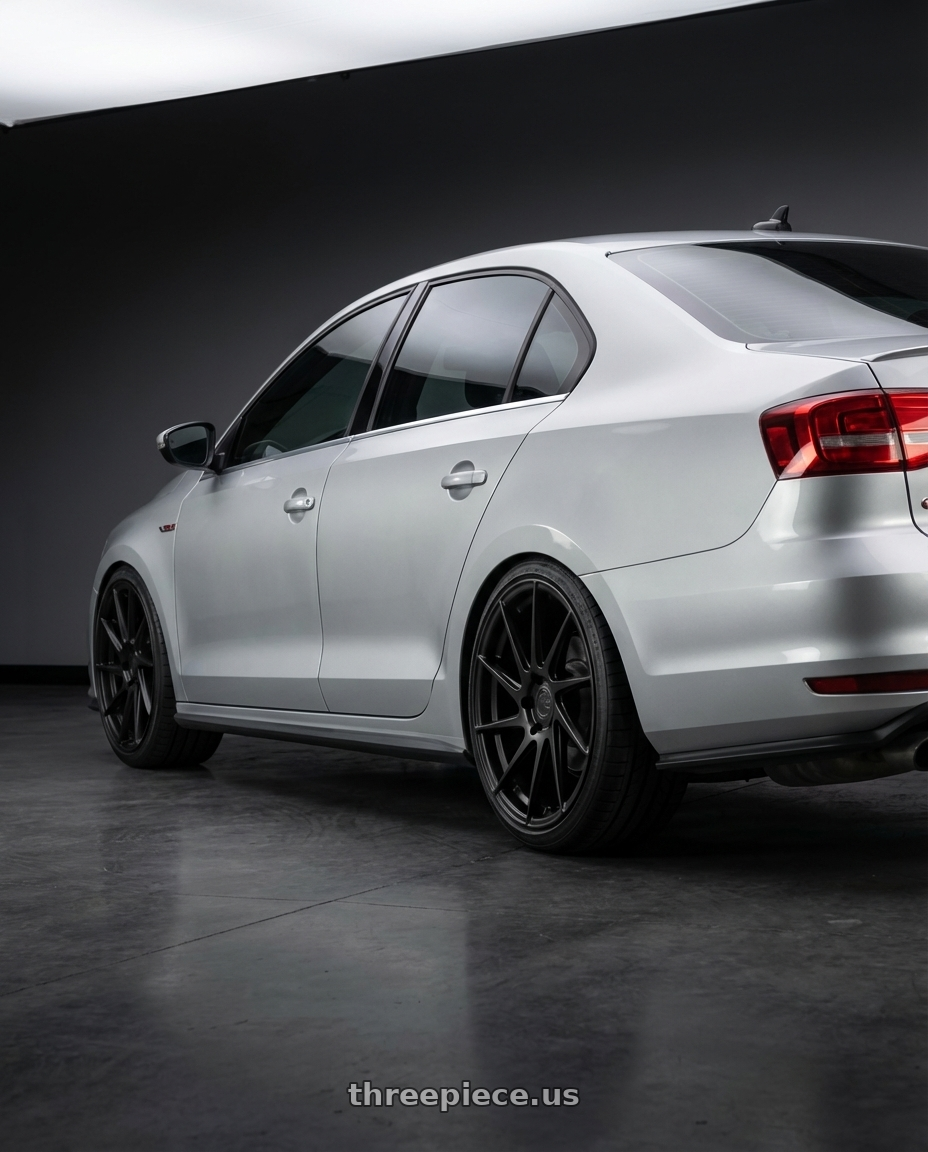 2016 Volkswagen Jetta GLI MK6 with Aodhan AH09 5x112 18x8.5 +35 Matte Black wheels rear three quarter view square tires