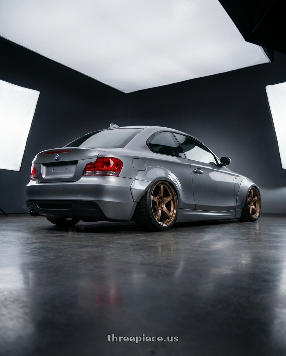 2012 BMW 1 Series E82 with Gram Lights 57CR 5x120 18x9.5+38 Bronze II wheels rear three quarter view slight stretch tires