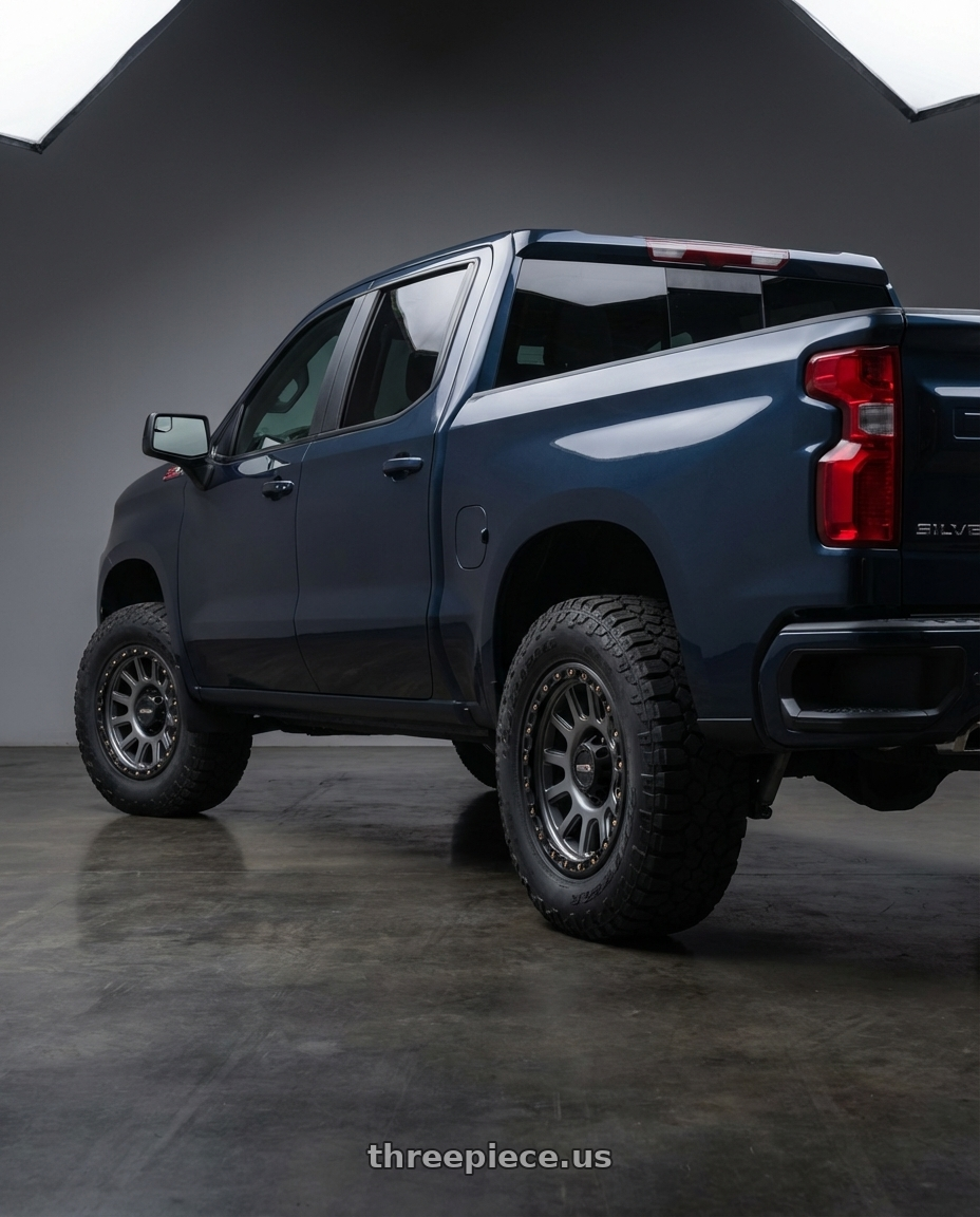 2023 Chevrolet Silverado 1500 with Vision Off-Road 111 Nemesis 6x139.7 20x9+12 Gunmetal wheels rear three quarter view meaty tires