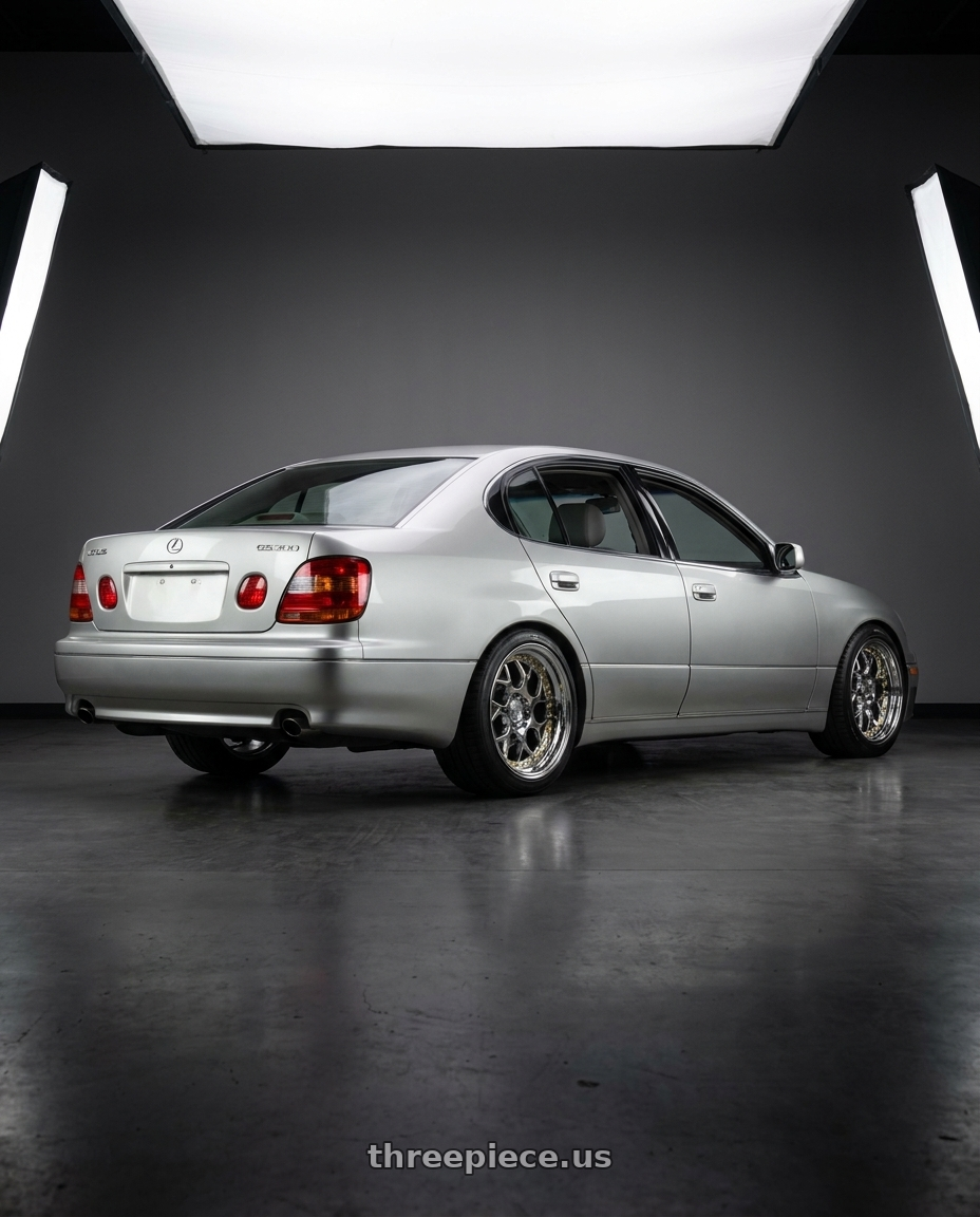 2001 lexus gs300 base silver with Aodhan DS01 5x114.3 18x8.5+35 Vacuum Chrome W/ Gold Rivets wheels rear three quarter view square tires