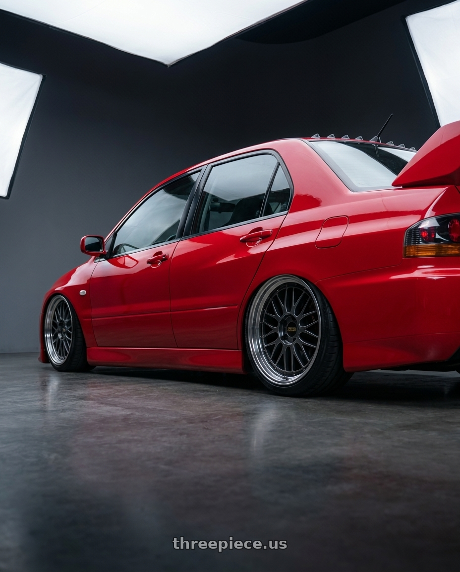 2005 Mitsubishi evo with BBS LM 5x114.3 18x8.0+35 Diamond Black wheels rear three quarter view slight stretch tires