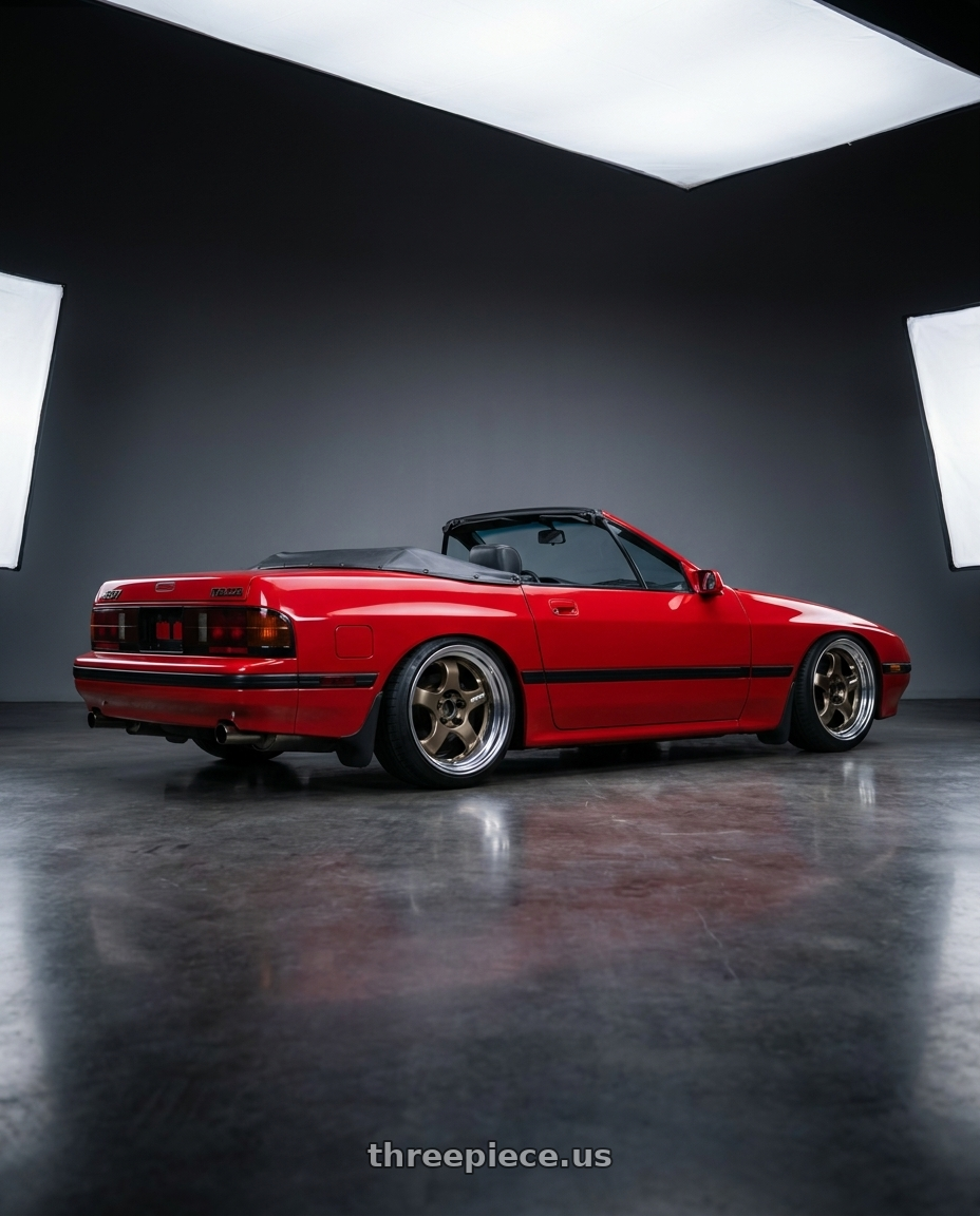 1988 RX-7 FC with Work Meister S1 2P 5x114.3 15x6.5+45 O Disk Titanium Gold wheels rear three quarter view square tires