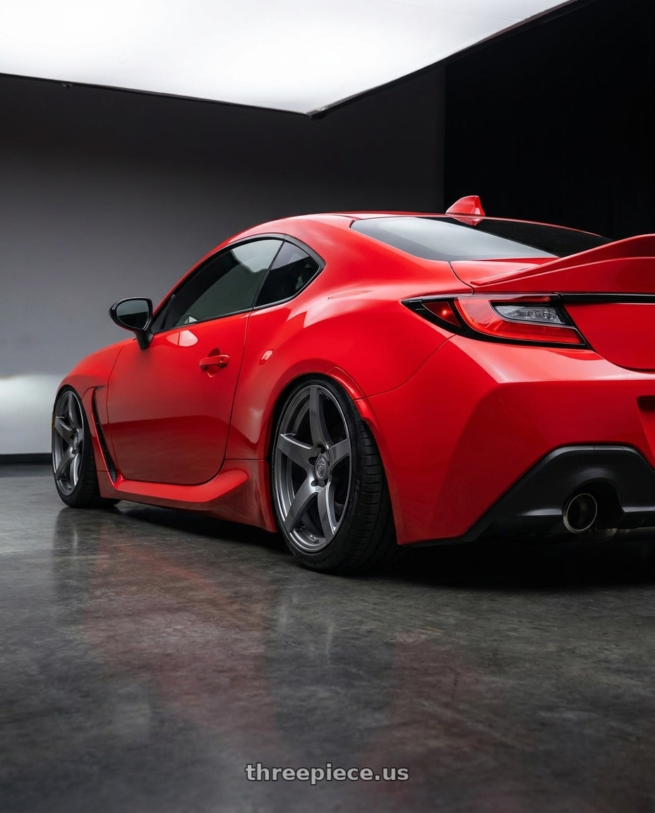 2024 Toyota GR86 with Forgestar CF5 5x114.3 18x9 +35 Gloss Anthracite wheels rear three quarter view slight stretch tires