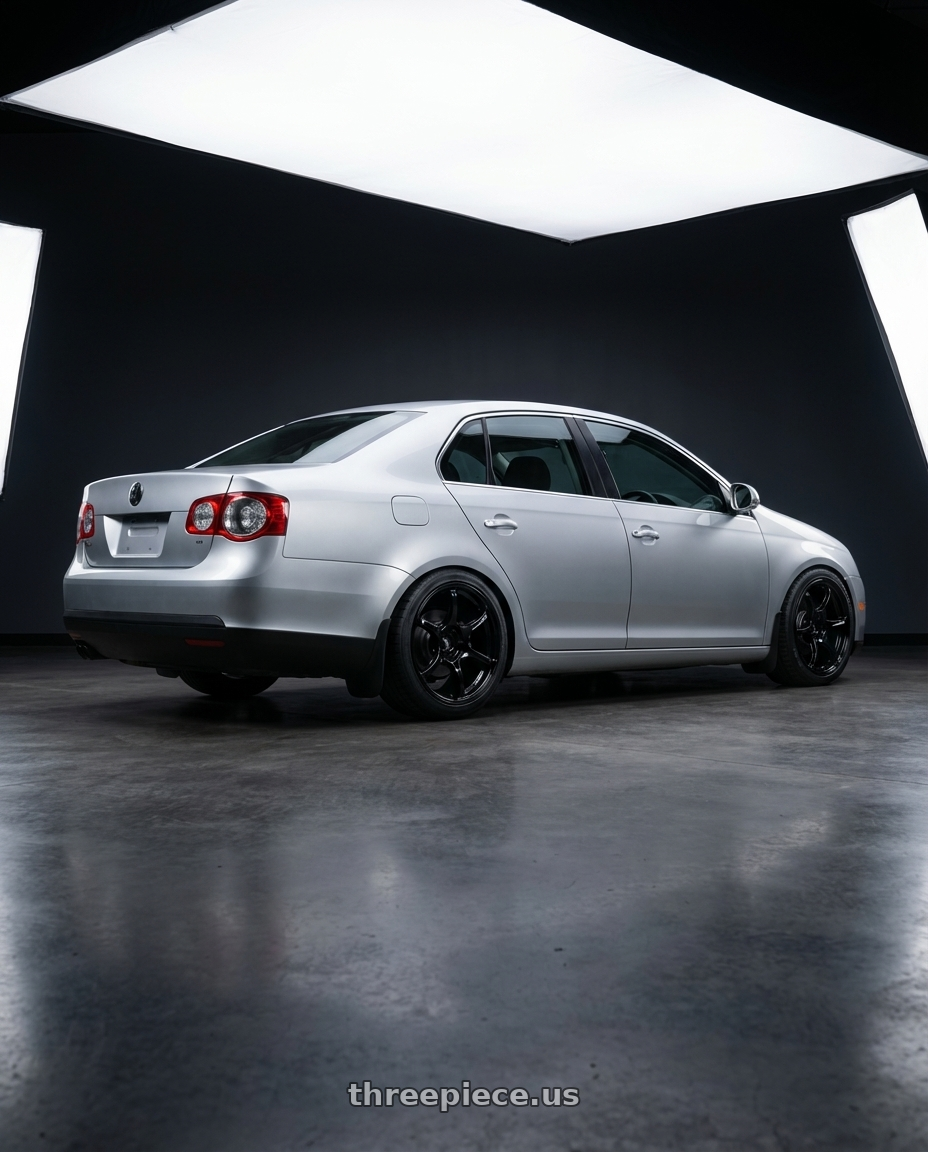 2009 Volkswagen Jetta GLI MK5 with Advan RGIII 5x112 18x8+42 Gloss Black wheels rear three quarter view square tires