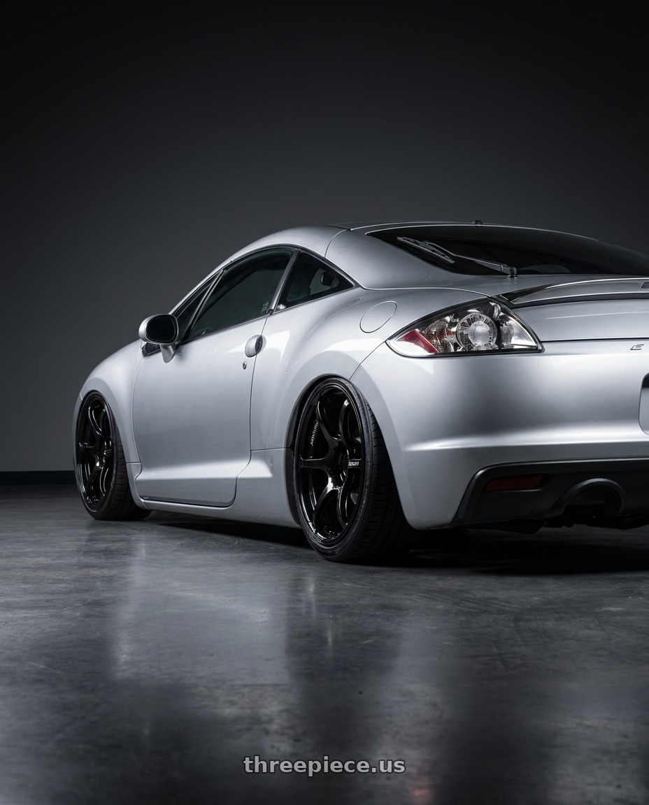2010 Mitsubishi Eclipse with Advan RGIII 5x114.3 18x9.0+25 Gloss Black wheels rear three quarter view slight stretch tires