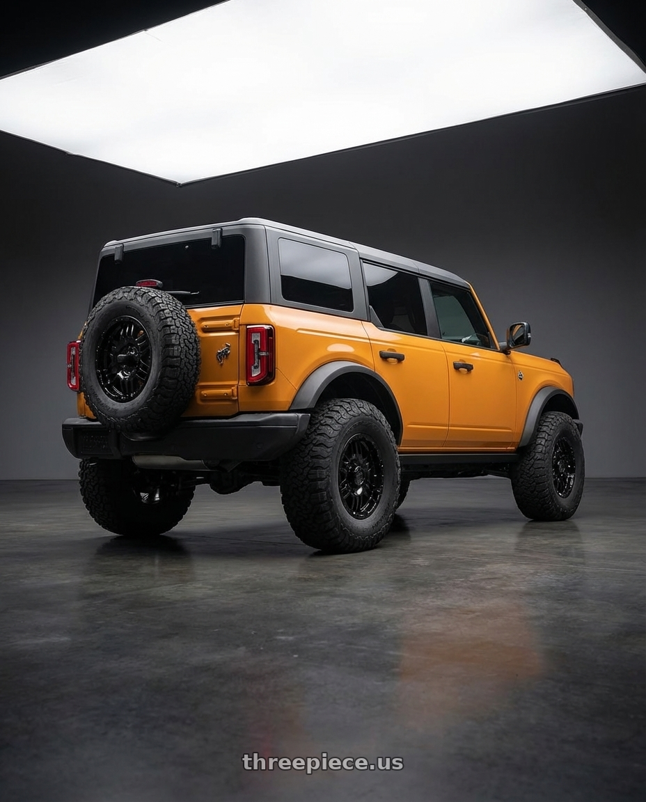 2024 Ford Bronco with Gear Off Road 713B 6x139.7 17x9 +10 Gloss Black wheels rear three quarter view meaty tires