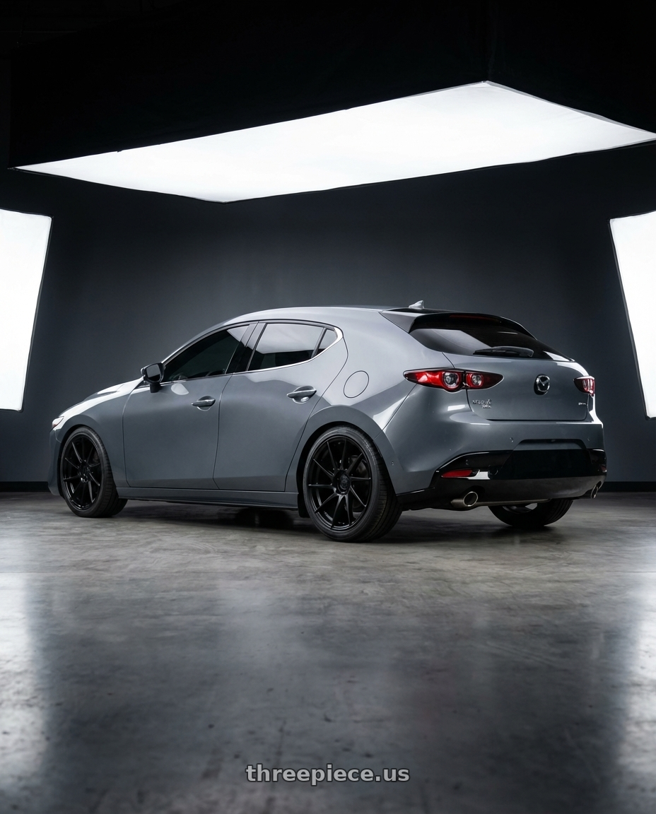 2023 Mazda Mazda3 Turbo with Aodhan AH09 5x114.3 18x9.5 +35 Hyper Black wheels rear three quarter view square tires