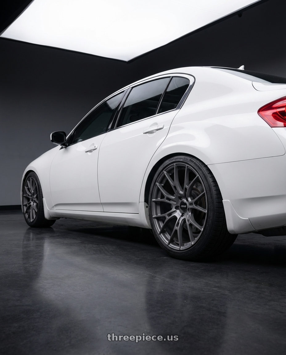2012 Infiniti G37 with Gram Lights 57FXM 5x114.3 19x8.5+45 Matte Graphite wheels rear three quarter view square tires