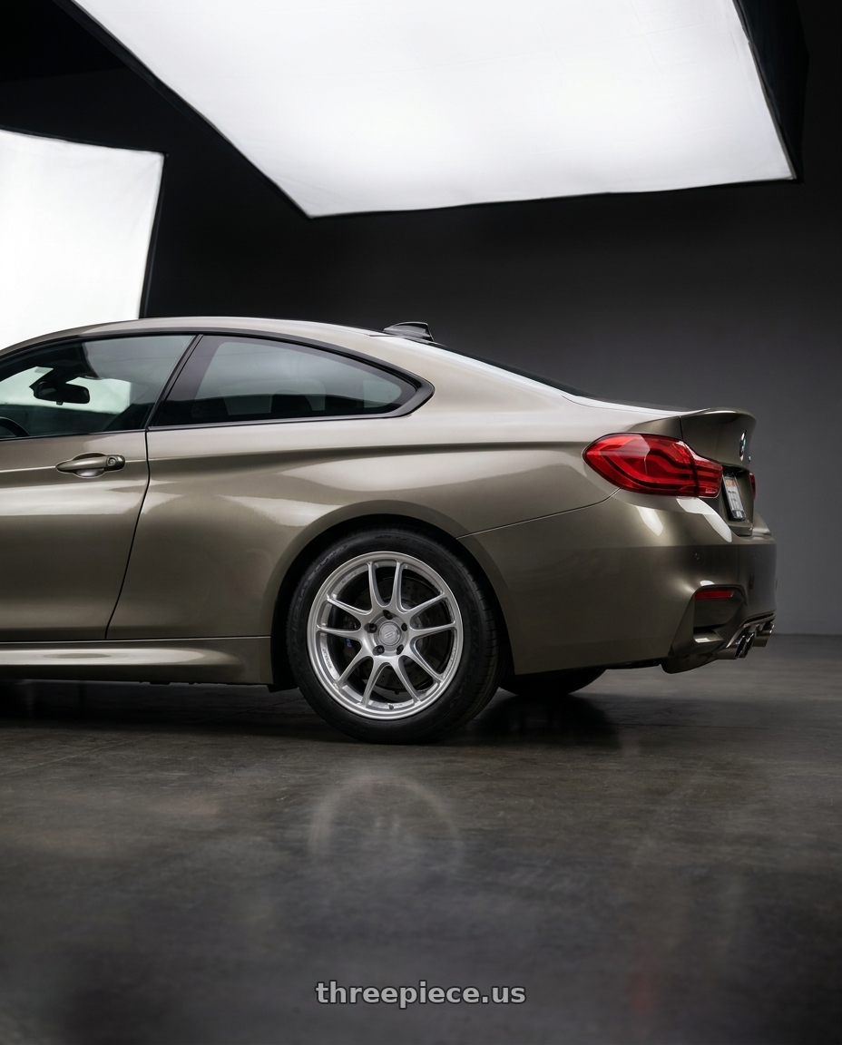2019 bmw m4 with Enkei PF01 5x100 17x8+35 Silver wheels rear three quarter view meaty tires