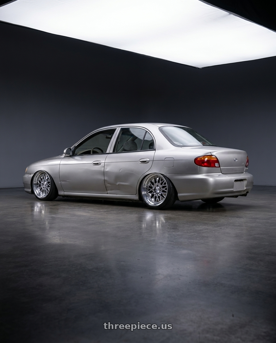 1999 Kia Sephia with Heritage Wheel BELFORT wheels rear three quarter view slight stretch tires