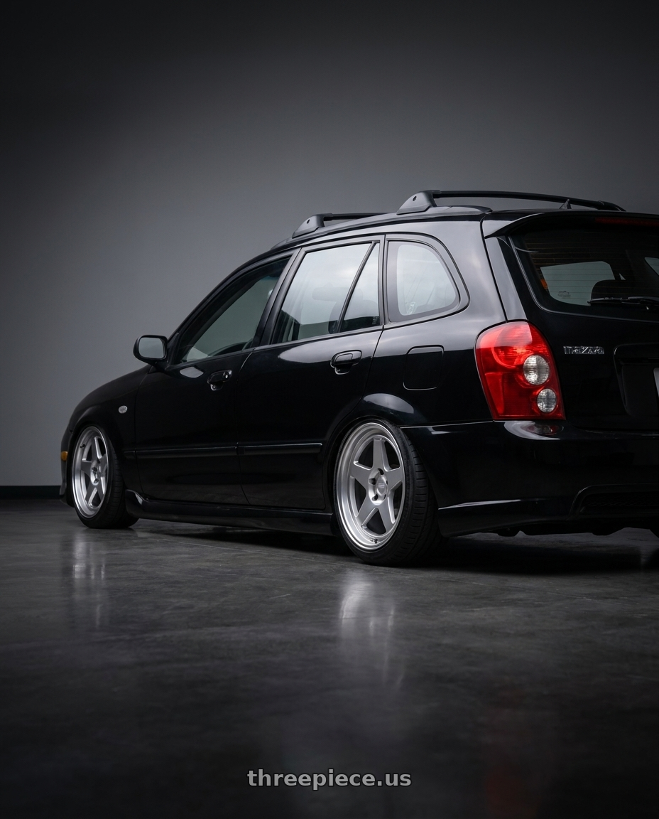 2002 Mazda Protege5 with Kansei K12H KNP 5X120 17x9 22 Hyper Silver wheels rear three quarter view square tires