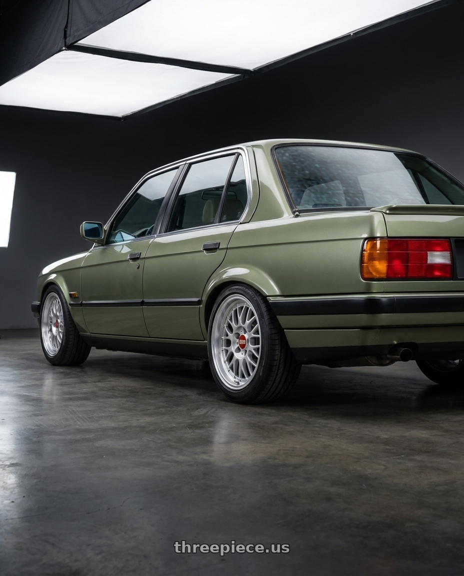 1987 bmw e30 with BBS RG-F 4x100 15x7 +33 Sport Silver wheels rear three quarter view square tires
