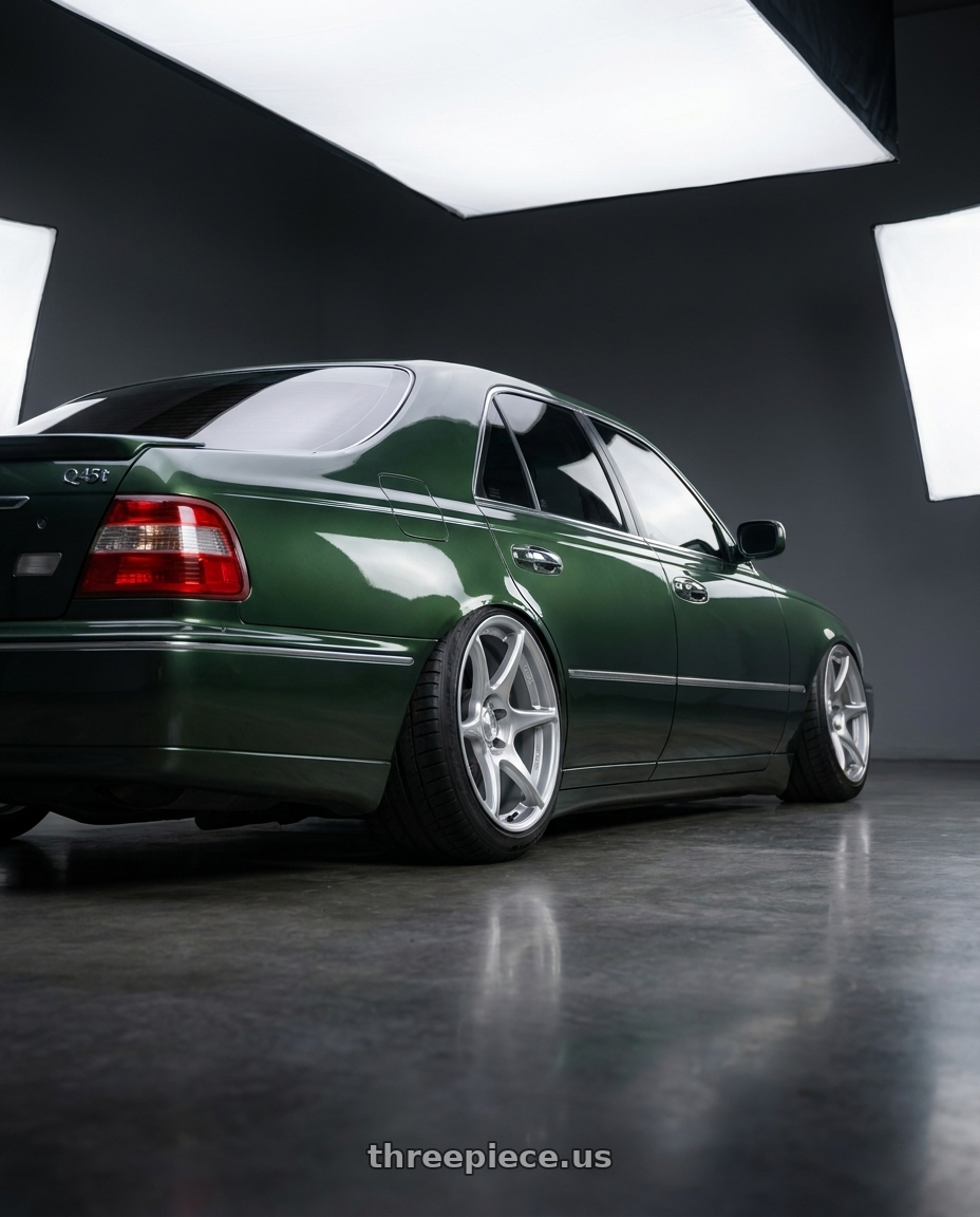 2000 Infiniti Q45 with Kansei K11S Tandem 5x114.3 19x10.5 12 Hyper Silver wheels rear three quarter view meaty tires