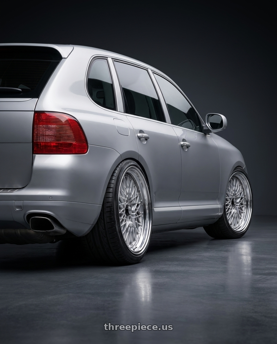 2005 Porsche Cayenne Turbo with SSR Formula MESH 5x130 19X10+49 SL Disk Fm Silver wheels rear three quarter view extreme stretch tires