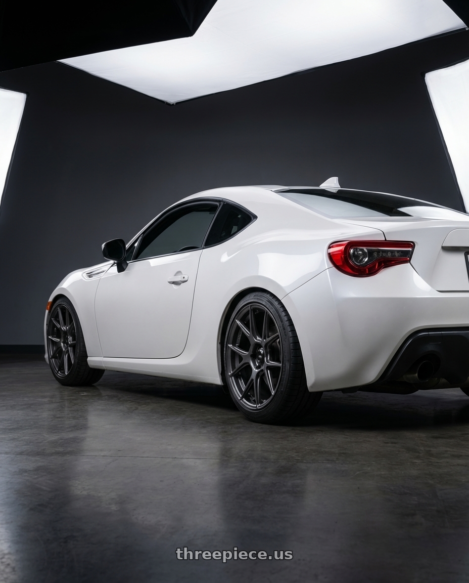 2016 Scion FR-S with Konig Ampliform 5x100 17x9+40 Dark Metallic Graphite wheels rear three quarter view square tires