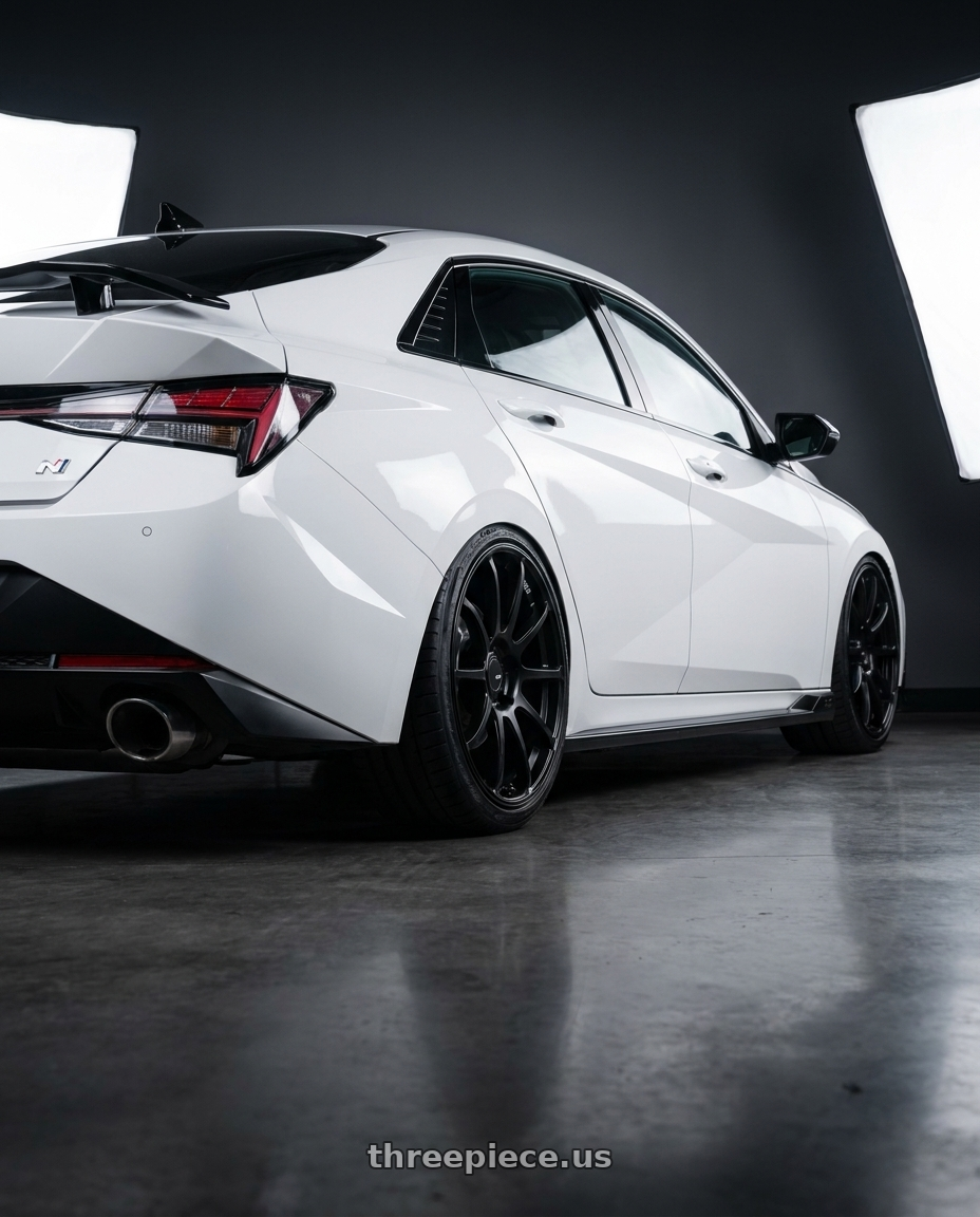 2024 Hyundai Elantra N with Ssr Gtv02 5x114.3 19x8.5+38  FLAT BLACK wheels rear three quarter view slight stretch tires