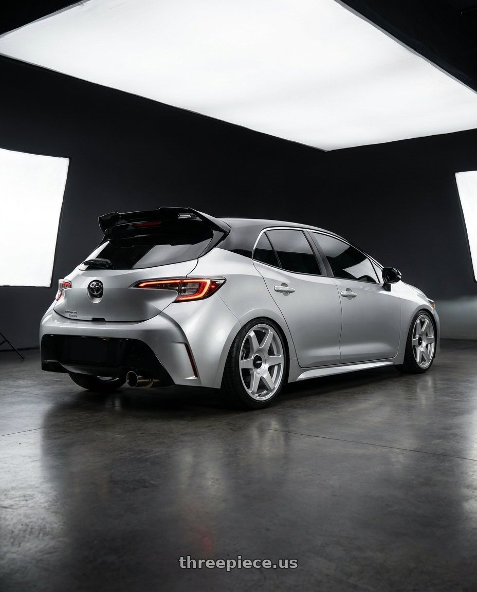 2021 toyota corolla sport E210 with Rotiform 1PC R114 SIX BLANK 18X8.5 +35 GLOSS SILVER wheels rear three quarter view slight stretch tires