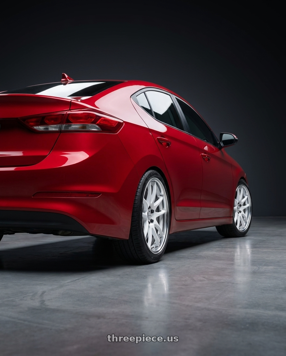 2017 Hyundai Elantra with Work Cr 2P 4x100 17x8.0 +45 Gloss White wheels rear three quarter view square tires