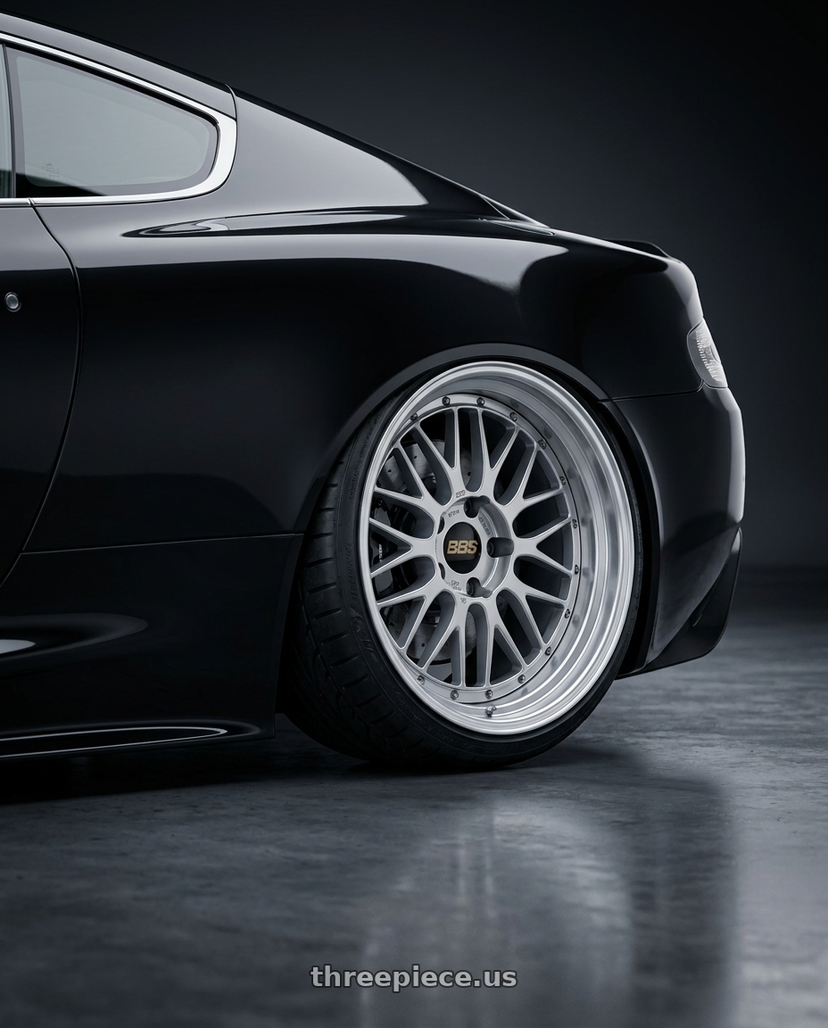 2009 Aston Martin DBS Black with BBS LM 5x114.3 17x7.5+38 Diamond Silver wheels rear three quarter view extreme stretch tires