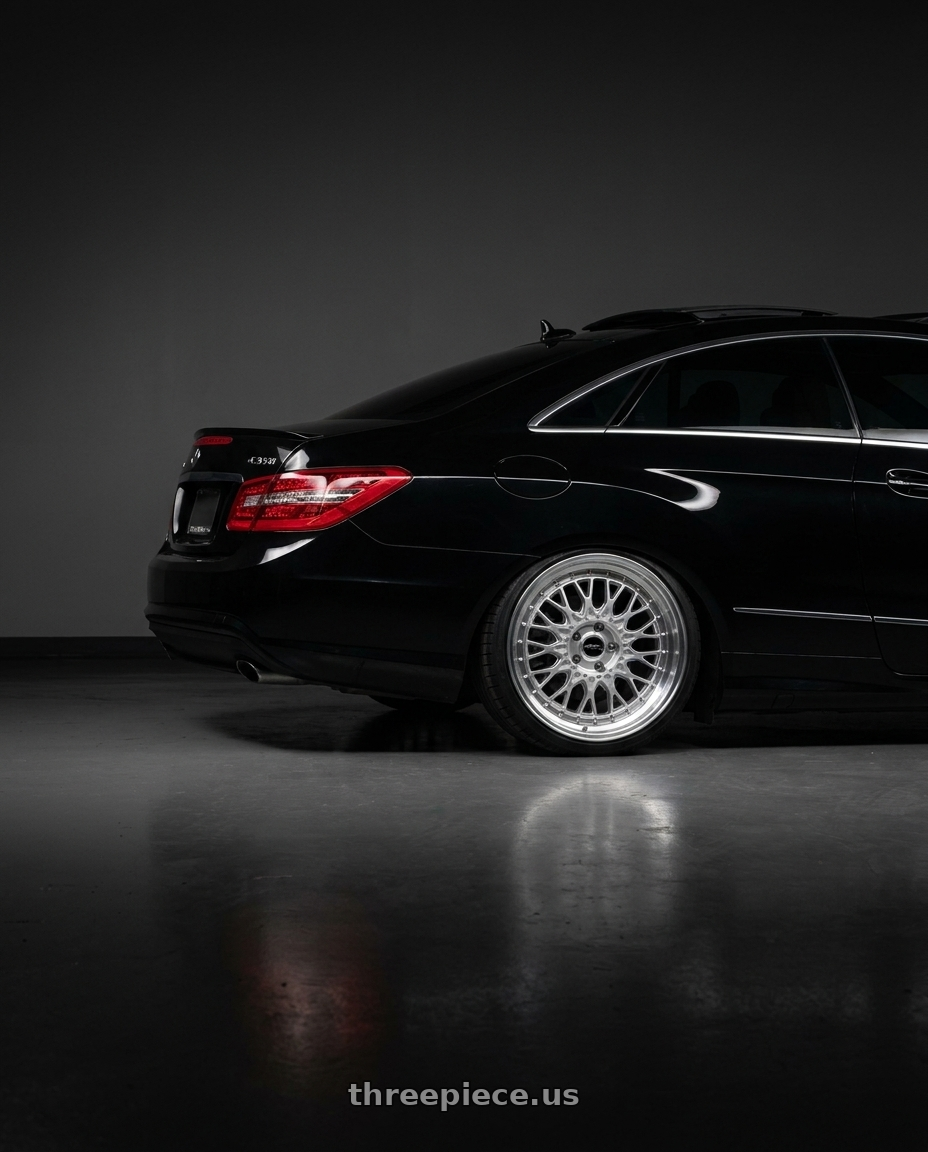 2013 Mercedes-Benz E350 4Matic with ARC AR1 5x112 18x8.5  +35 Silver Machine Face Lip Chrome Rivet wheels rear three quarter view square tires