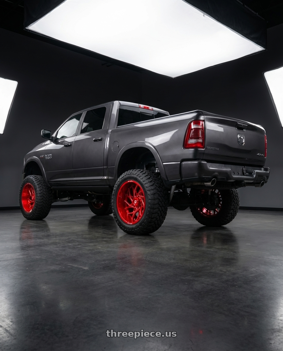 2024 Ram 1500 with Fuel 1PC D742 RUNNER 6X139.7 24X12 -44 CANDY RED MILLED wheels rear three quarter view meaty tires