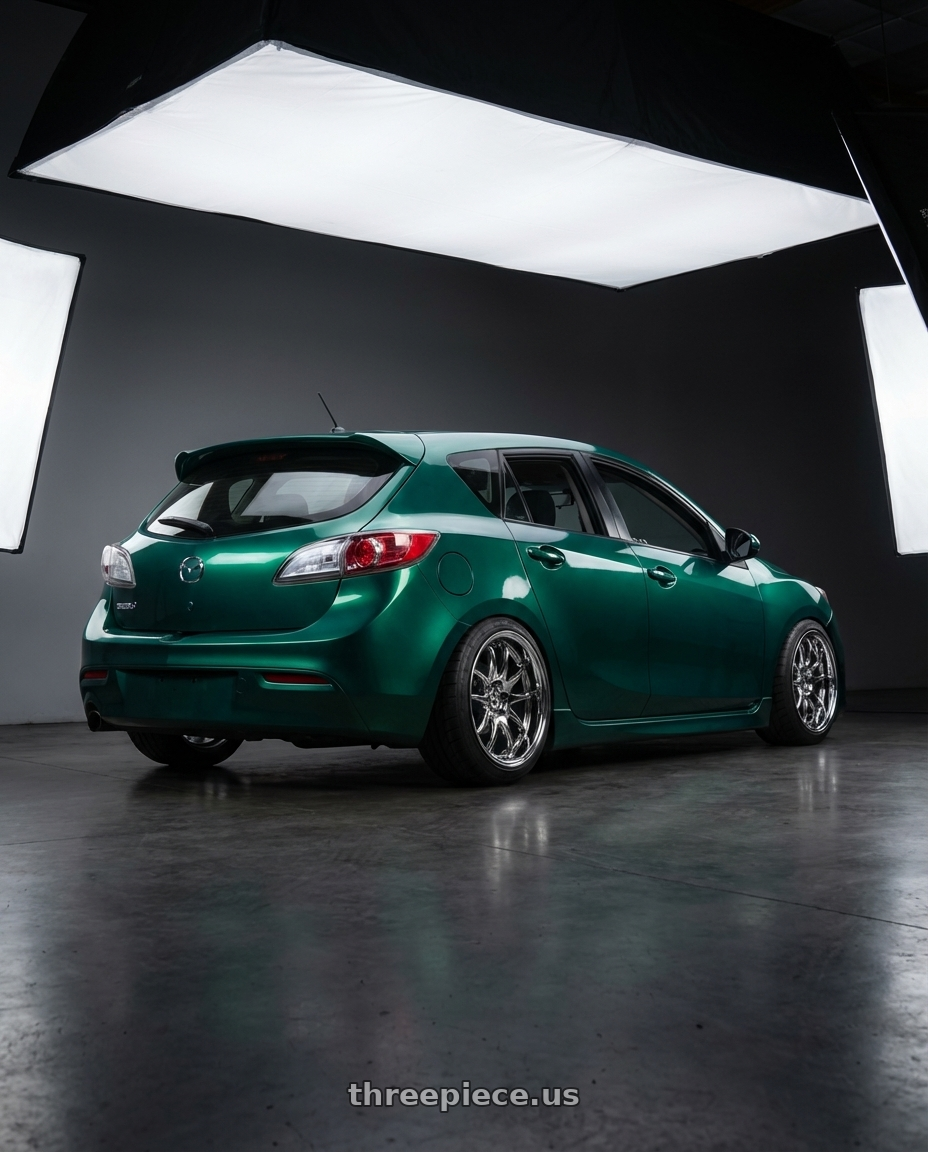 2011 mazda 3 hatchback deep jewel green with Aodhan DS02 5x114.3 18x10.5+15 Vacuum Chrome wheels rear three quarter view meaty tires