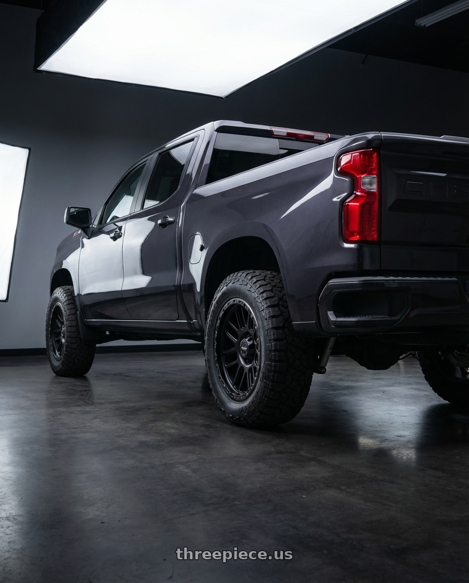 2023 Chevrolet Silverado 1500 with Vision Off-Road 111 Nemesis 6x139.7 20x9+0 Matte Black wheels rear three quarter view meaty tires