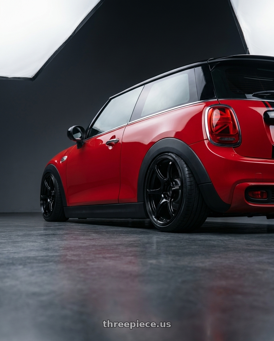 2019 Mini Cooper S F56 with Advan RGIII 4x100 18x7.0+42 Gloss Black wheels rear three quarter view slight stretch tires