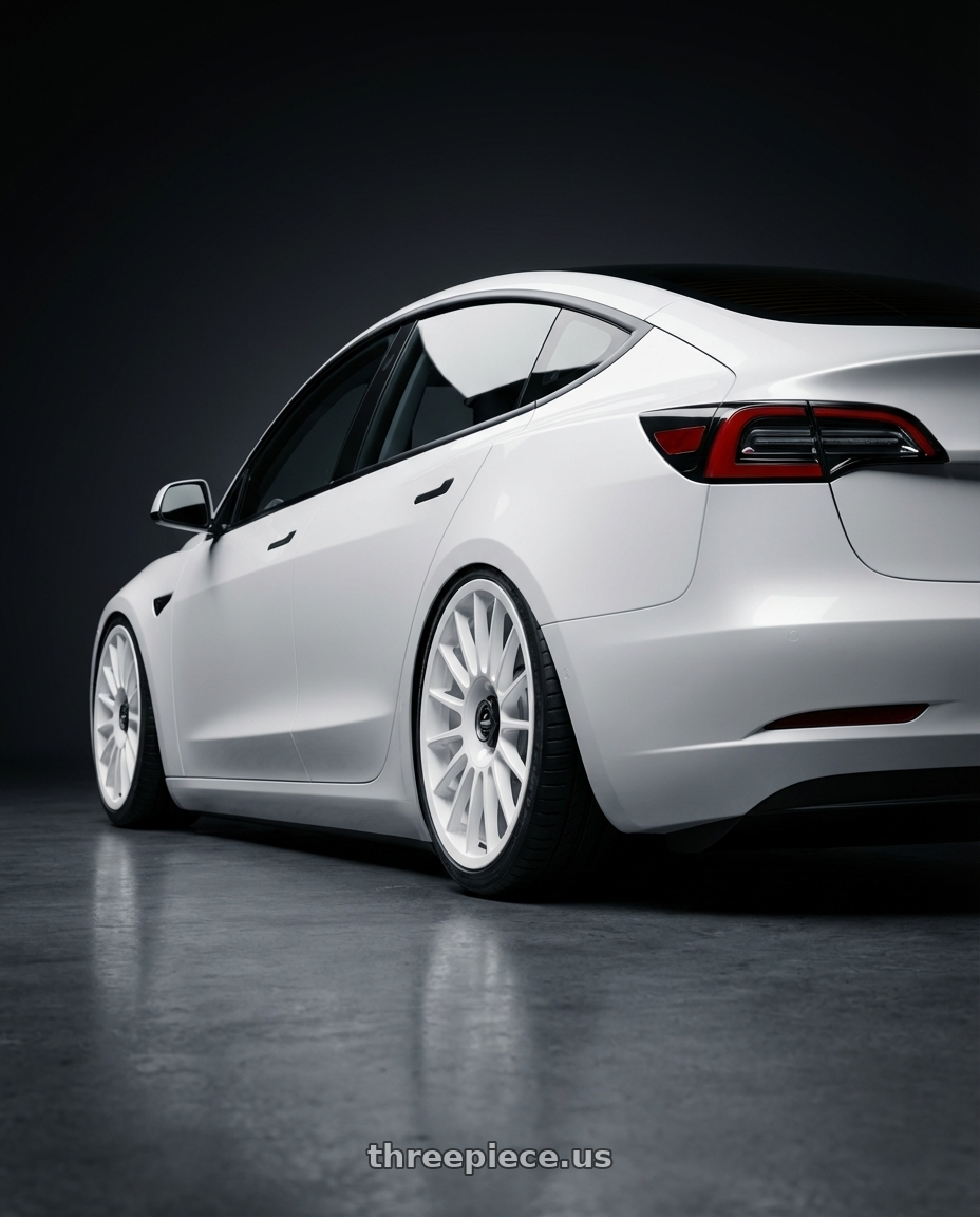 2023 Tesla Model 3 with fifteen52 PODIUM 5x114.3 / 5x120 19x8.5 +35 RALLY WHITE (GLOSS WHITE) wheels rear three quarter view slight stretch tires