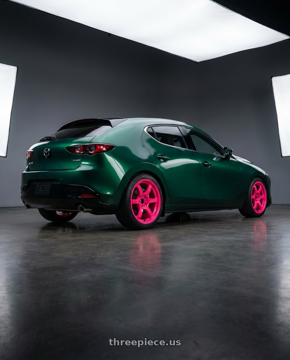 2026 Mazda 3 with Gram Lights 57DR 5x100 18x9.5+38 Luminous Pink wheels rear three quarter view square tires
