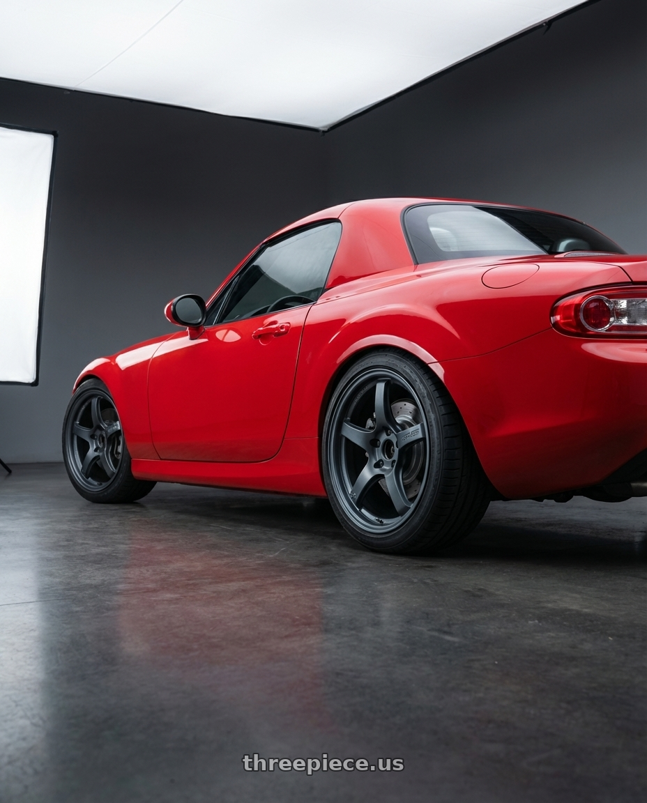 2012 Mazda MX-5 Miata NC with Gram Lights 57CR 5x114.3 17x9+38 Gunblue II wheels rear three quarter view square tires