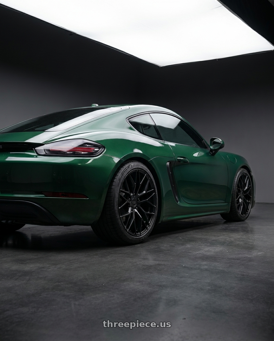 2019 Cayman 718 Porsche, Aston Martin metallic British Racing Green with KATANA RACING KR01 5x100 17x7.5 +40 Matte Black wheels rear three quarter view square tires
