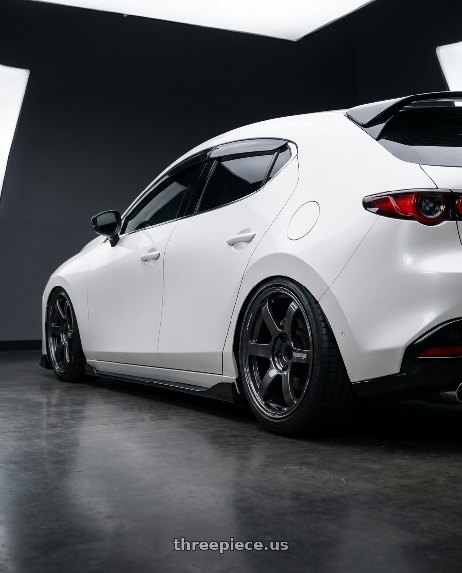 2023 MAZDA3 BP with Volk Racing TE37 Saga S-Plus 5x100 18x8.5+45 Diamond Dark Gunmetal wheels rear three quarter view square tires