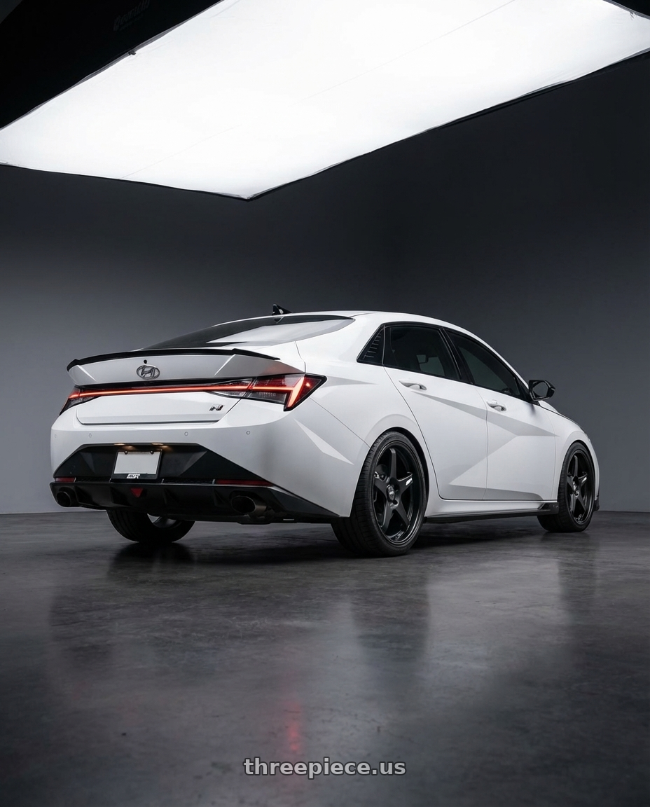 2024 Hyundai Elantra N with ESR Wheels APEX SERIES AP5 5x114.3 19x8.5 +30 Matte Black wheels rear three quarter view square tires