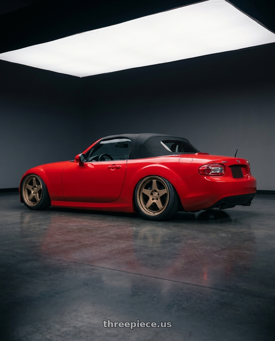2012 Mazda MX-5 Miata NC with Kansei K12B KNP 5x114.3 17x9 22 Bronze wheels rear three quarter view slight stretch tires