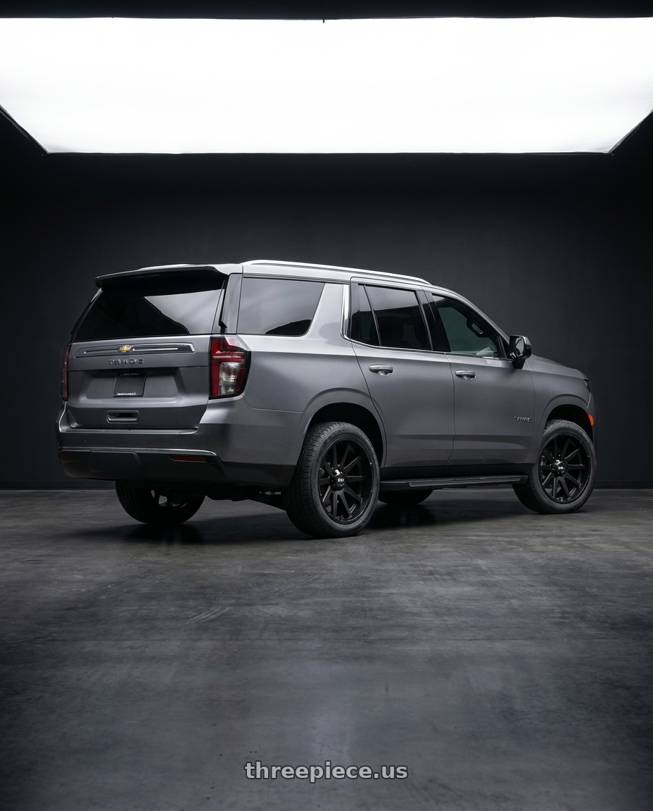 2021 Chevrolet Tahoe LS with Ion Type 143 6x139.7 20x9+0 Matte Black wheels rear three quarter view square tires