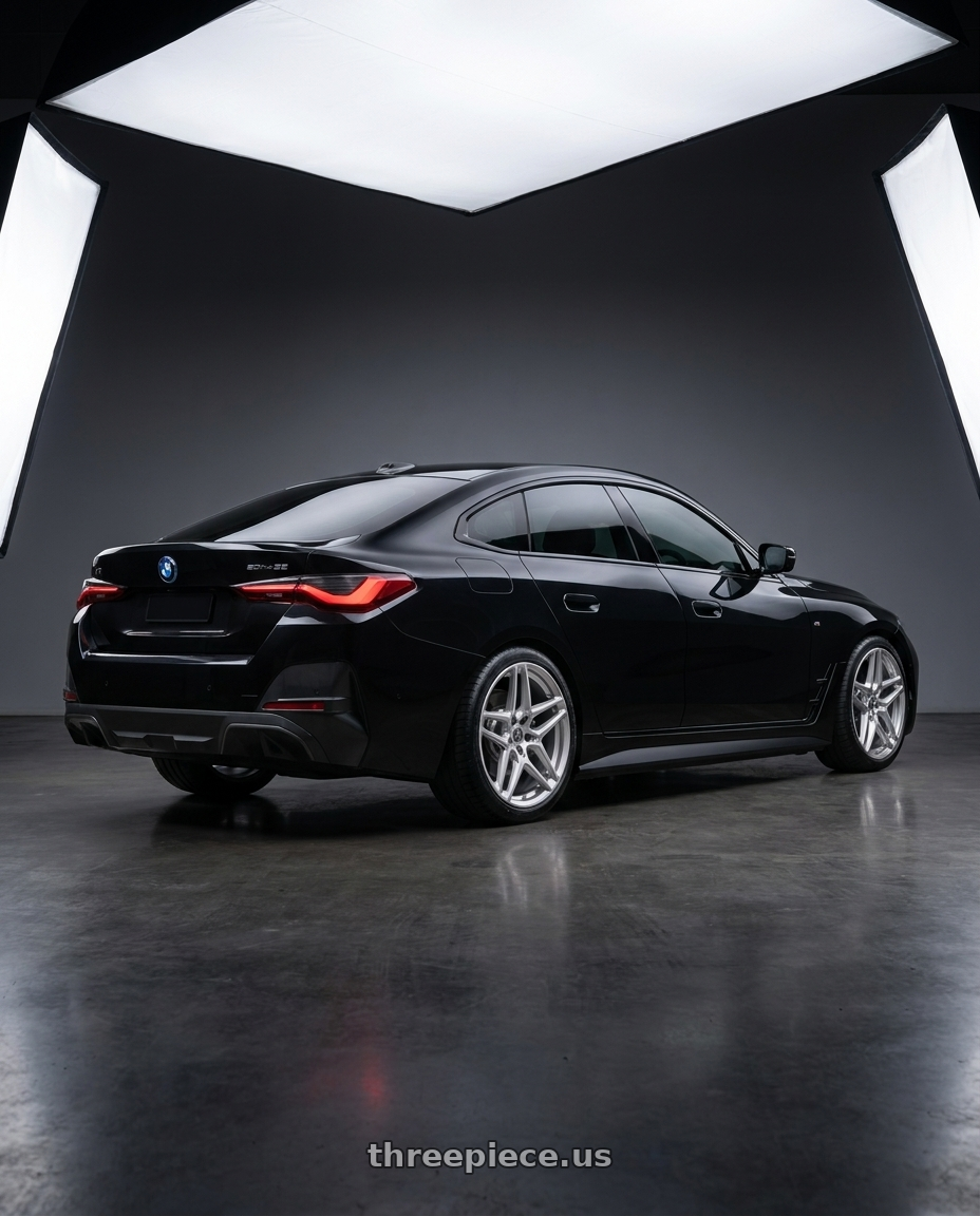 2023 bmw i4 edrive35 black with HERITAGE WHEEL EBISU MONOC 5x112 20x9 +25 SILVER wheels rear three quarter view square tires