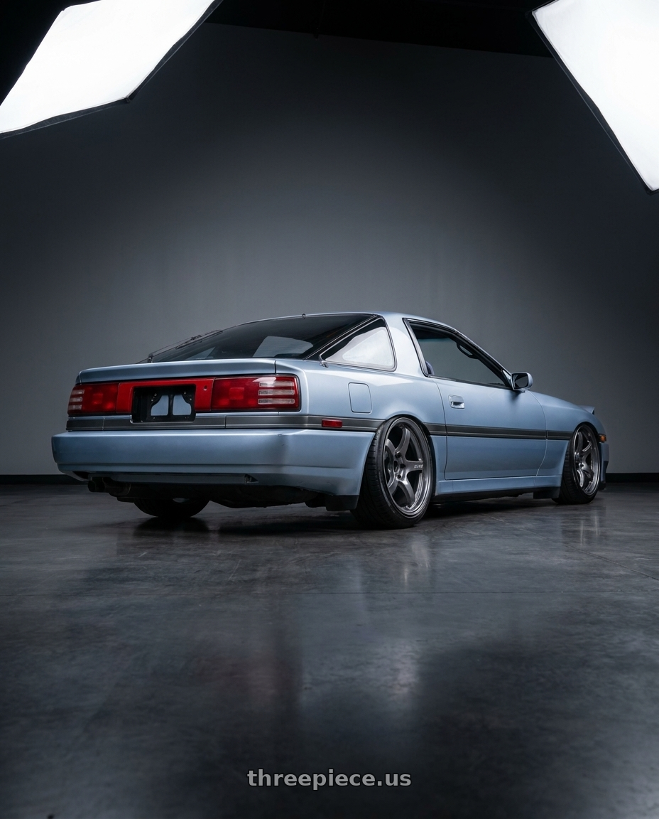 1987 Toyota Supra with Gram Lights 57CR 5x114.3 18x9.5+38 Glossy Grey wheels rear three quarter view extreme stretch tires