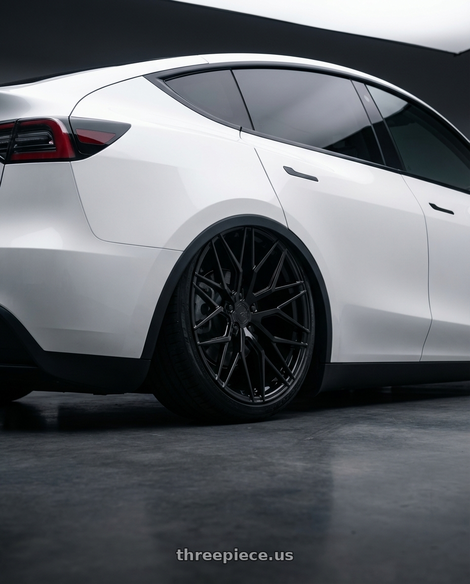 2024 Tesla Model Y with Avant Garde Wheels M520R 5X114.3 20x10 +35 Gloss Black wheels rear three quarter view slight stretch tires