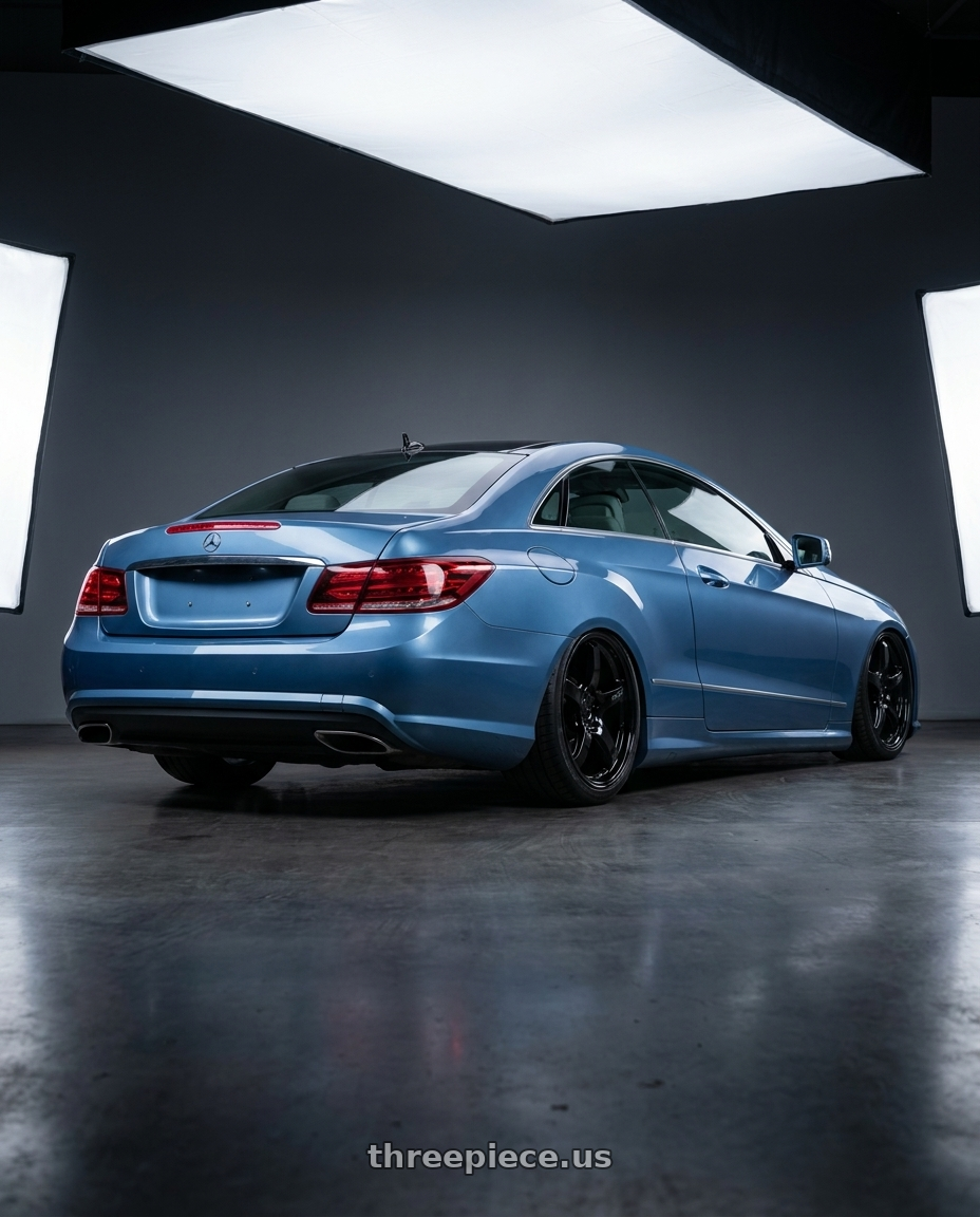 2014 Mercedes-Benz E-Class Coupe C207 with Gram Lights 57CR 5x112 19x8.5+45 Glossy Black wheels rear three quarter view slight stretch tires