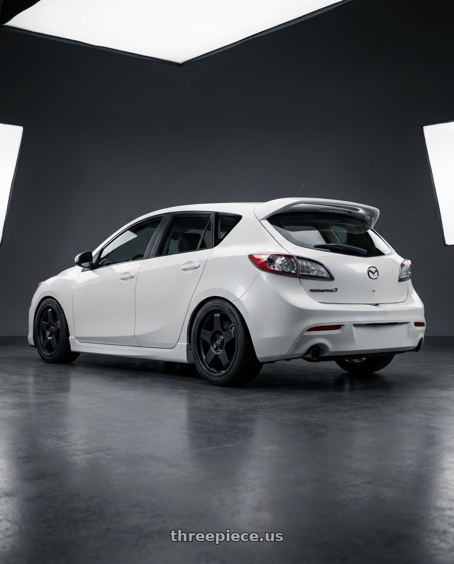2012 Mazda Mazdaspeed3 with fifteen52 CHICANE 5x114.3 / 5x100 18x8.5 +35 ASPHALT BLACK (SATIN BLACK) wheels rear three quarter view square tires