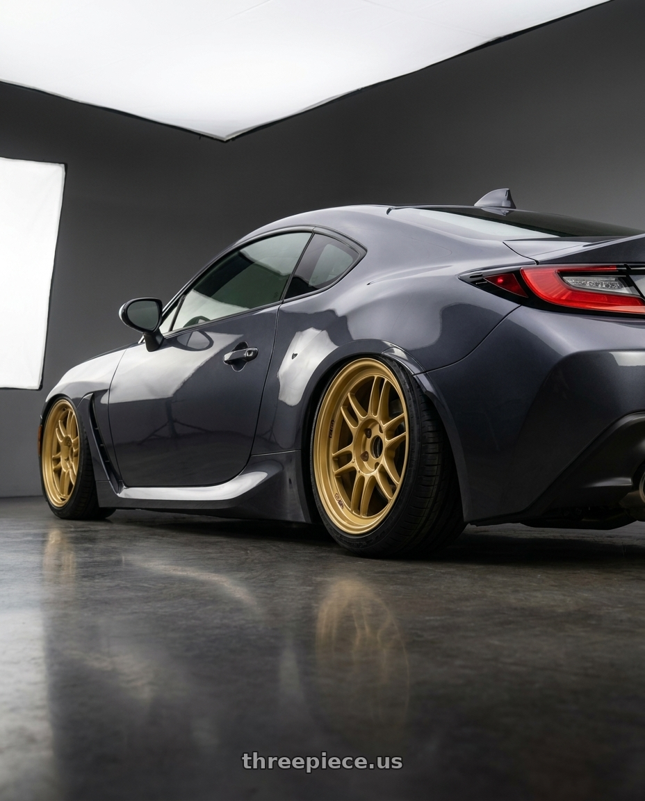 2022 Subaru brz with Enkei RPF1 5x100 18x8+45 Gold wheels rear three quarter view slight stretch tires