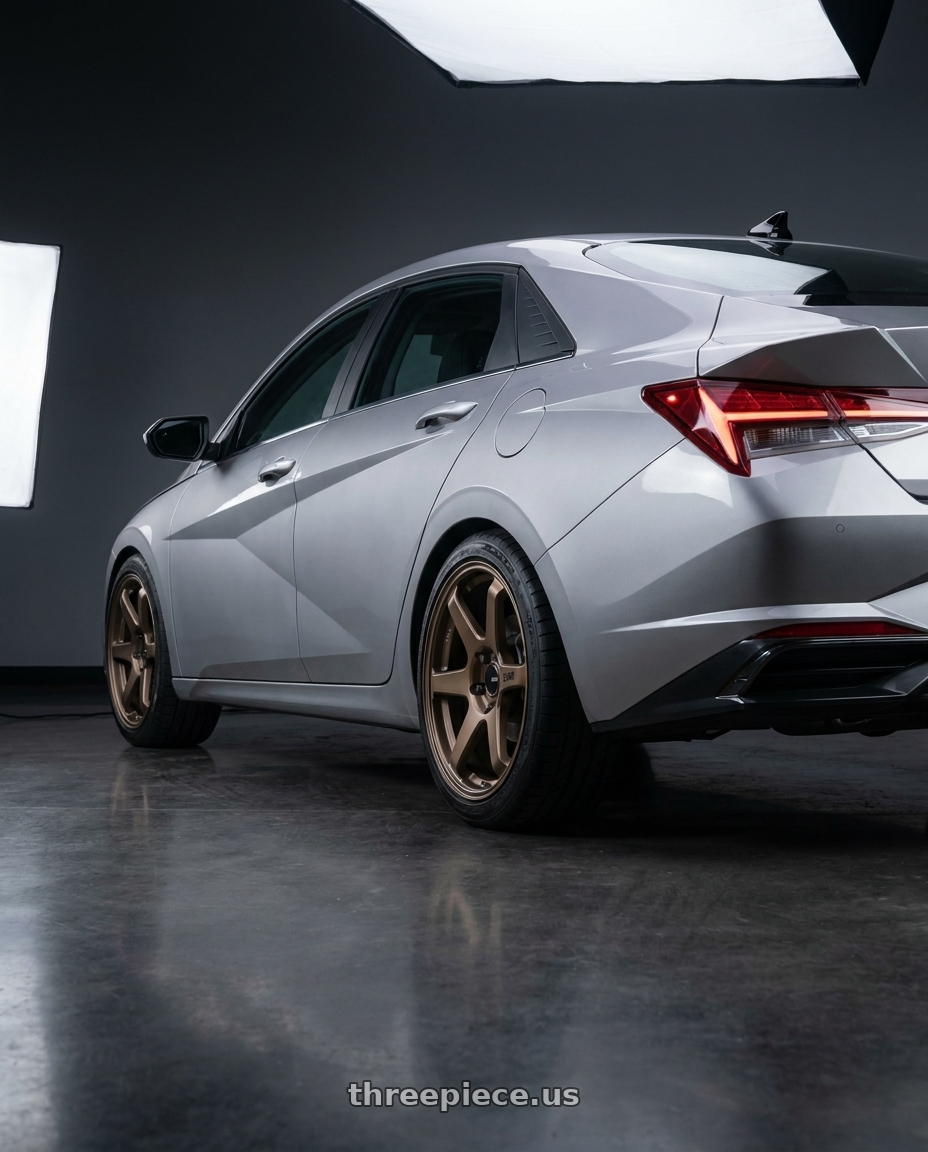 2021 Hyundai Elantra Limited with Enkei T6R 5x114.3 18x8.5+38 Matte Bronze wheels rear three quarter view square tires