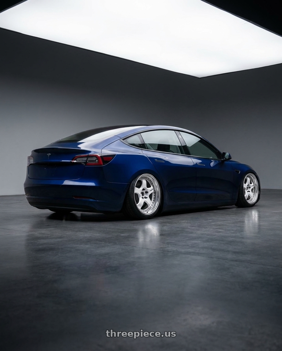 2023 Tesla model 3 with Work Meister S1 3P 5x114.3 18x8.5+35 L Disk White wheels rear three quarter view square tires