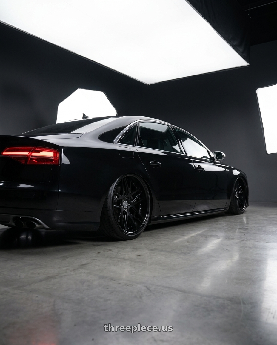2016 Audi S8 with Work Gnosis Cvx 5x112 22x12+22 A Disk Matte Black wheels rear three quarter view extreme stretch tires