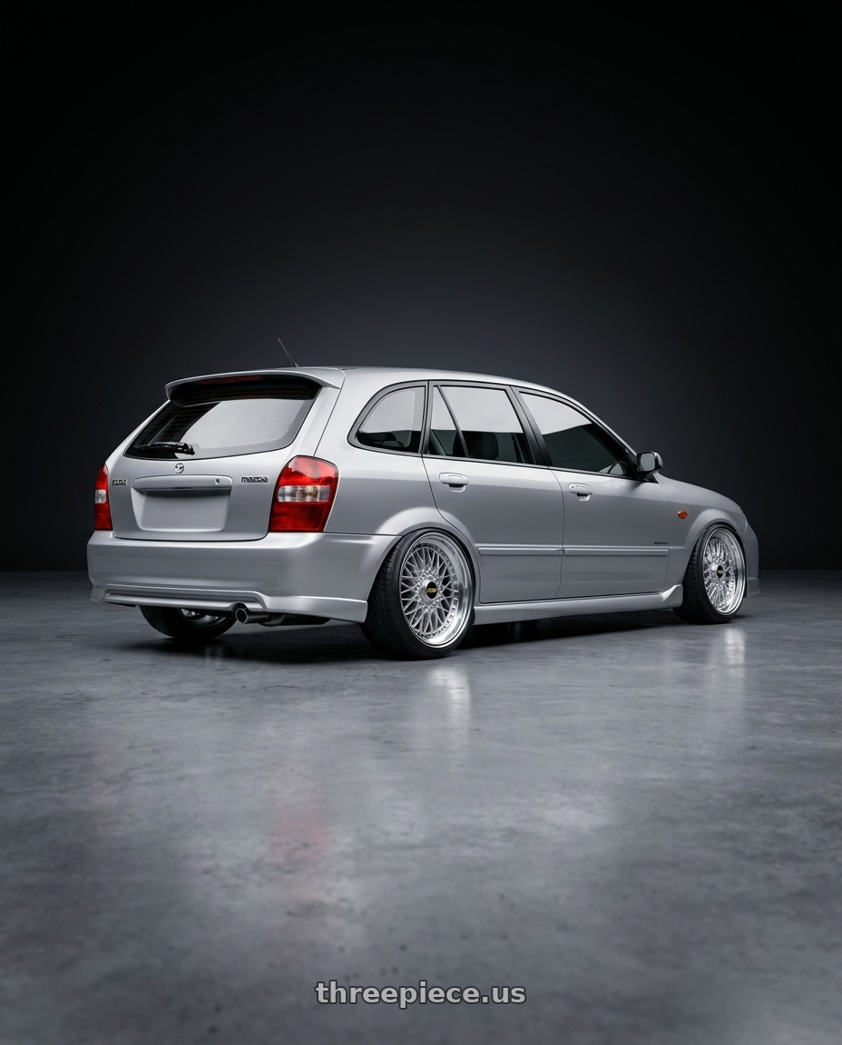 Mazda 323 2000 with BBS Super 5x112 19x9 +28 Diamond Silver wheels rear three quarter view extreme stretch tires