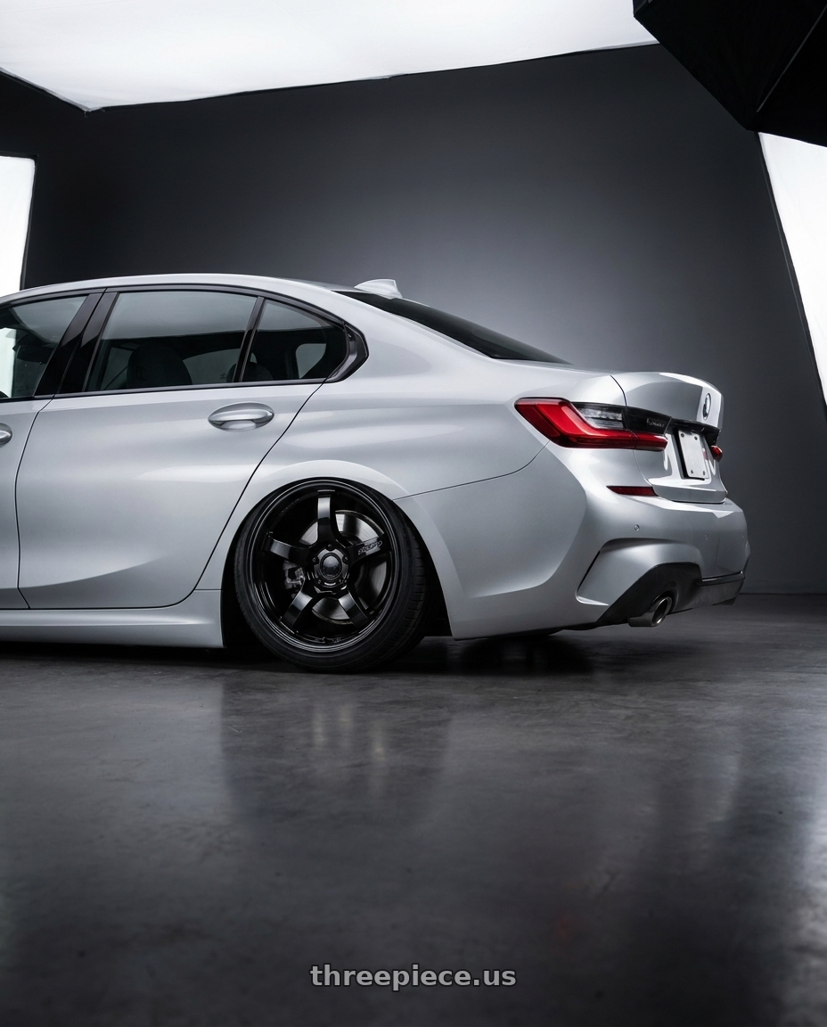 2023 BMW 3 Series G20 with Gram Lights 57CR 5x112 19x10.5+35 Glossy Black wheels rear three quarter view slight stretch tires