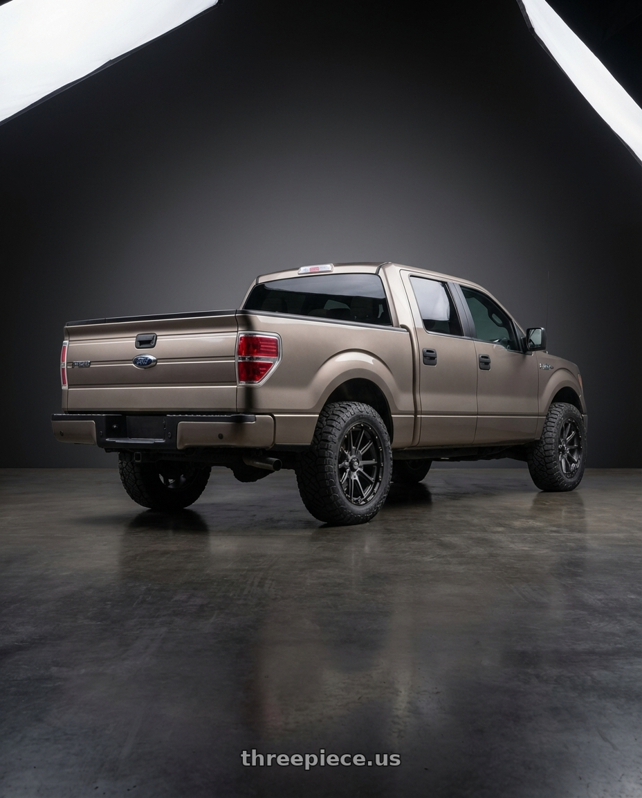 2013 Ford F-150 with KMC KM100 SYNC 6X135/6X139.7 20X9 +18 SATIN BLACK WITH GRAY TINT wheels rear three quarter view meaty tires